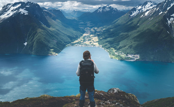 A person looking out on a vista while wearing the Hero's Journey